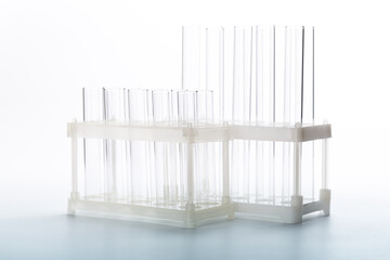 Fototapeta na wymiar pipette with a drop and scientific laboratory test tubes in a research laboratory.