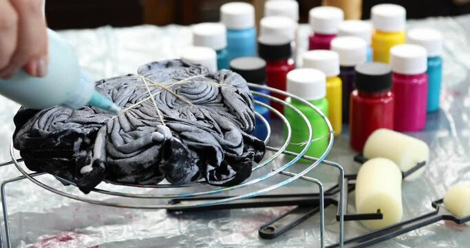 The process of painting in the style of tie dye