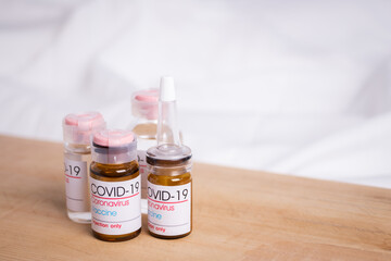Bottle of coronavirus vaccine on table.
 Coronavirus vaccine COVID-19. 2019.   