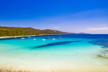 Beautiful Croatia. Aerial view of azure turquoise lagoon on Sakarun beach on Dugi Otok island, Croatia, yachts anchored in clear sea water.
