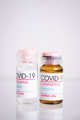 Bottle of coronavirus vaccine on table.
 Coronavirus vaccine COVID-19. 2019.   