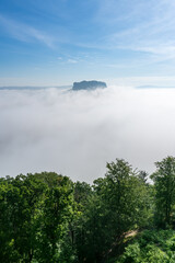 Famous Lilienstein mountain above the clouds in the Saxon Switzerland