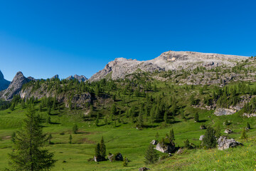 Fototapeta na wymiar Mountain shelter nuvolau near at Passo Giau, Dolomites in the spring