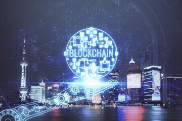 Multi exposure of cryptocurrency theme hologram drawing and city veiw background. Concept of blockchain and bitcoin.