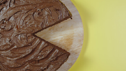 CLOSEUP: Chocolate cake without one piece - Top view