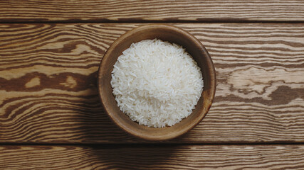 TOP VIEW: White rice in a wooden dish
