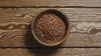 TOP VIEW: Buckwheats in a wooden dish
