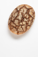 Traditional rye bread on a white background. Top view. Healthy food concept. 