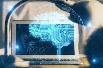 Double exposure of desktop computer and human brain drawing hologram. Ai concept.