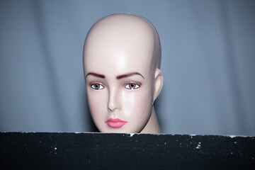 A series of photography lighting learning using Mannequin heads and different lighting settings. The image contains selective focus, blur and low speed and freeze effects