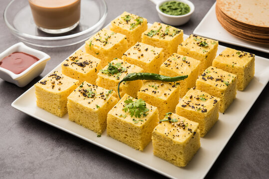 Gujarati Khaman Dhokla made using Chana Dal, served with Green chutney, selective focus