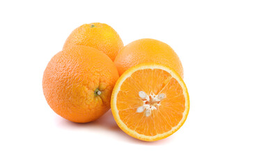 ripe oranges, whole and cut, close-up on a white background, horizontal view