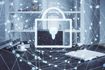 Double exposure of desktop with computer and lock icon hologram. Concept of data safety.