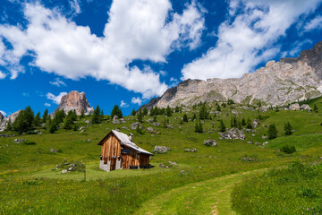 Fototapeta na wymiar Chalet in Passo giau under Ra Gusela massif, Nuvolau, Dolomites, Italy