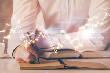 Financial trading chart multi exposure with man desktop background.