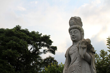 The statue of Kanon or Guanyin and stupa at Myohoji temple in Beppu, Japan