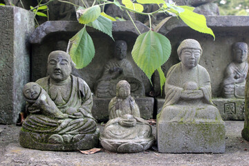 Statue of Buddha and Jizo at a Japanese temple