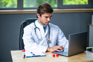 profesional doctor working at his desk collecting data
