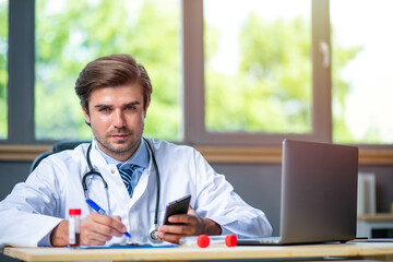 profesional doctor working at his desk collecting data