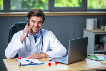profesional doctor working at his desk collecting data