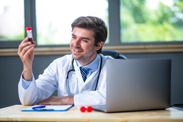 profesional doctor working at his desk collecting data
