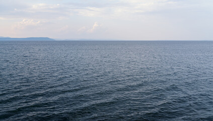 Seascape the background of the clear sky.