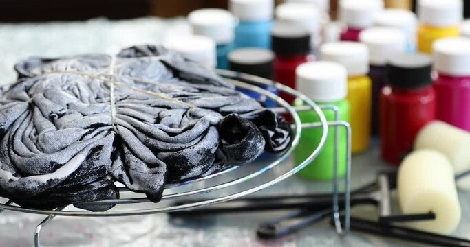 The process of painting in the style of tie dye