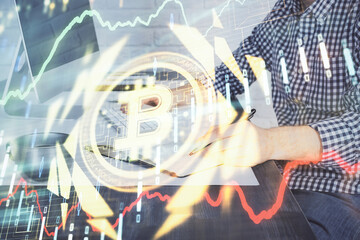 Blockchain theme hud with man working on computer on background. Concept of crypto chain. Double exposure.