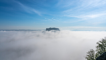 Famous Lilienstein mountain above the clouds in the Saxon Switzerland