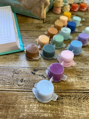 acrylic colored paints on a wooden table