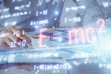 Science formula hologram with man working on computer on background. Education concept. Double exposure.