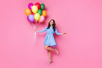 Full length body size view of her she nice attractive lovely stunning exquisite cheerful wavy-haired lady holding in hand bunch air balls having fun posing isolated pink pastel color background