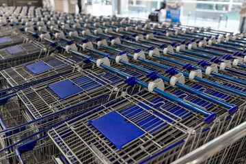 sale and consumerism concept - shopping carts at supermarket