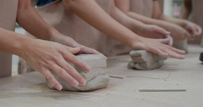 Kneading clay material before making pottery
