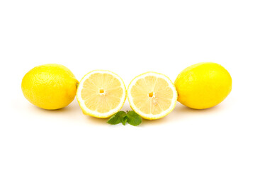 Group of lemons with mint leaves, isolated on white background