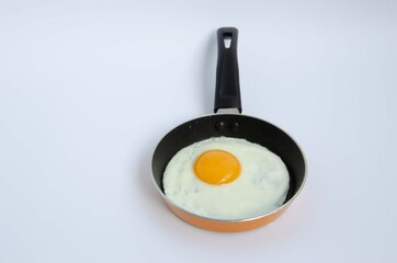 Fried egg in a small children's pan