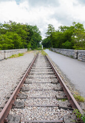 Ancient railroad line in Norman Switzerland (Clécy, Normandy, France). Located on a beautiful viaduct. Now it is the "voie verte" for bikers and pedestrians. Vertical shot