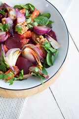 Beetroot, orange, red onion and walnut salad, a vegetarian healthy superfood.