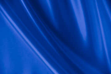 Beautiful elegant wavy classic blue satin silk luxury cloth fabric texture, abstract background...