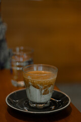 coffee latte art on the wood desk in coffee shop cafe