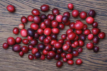 Red cranberries on wooden background