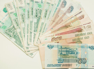 Money notes of one thousand, five hundred, one hundred and fifty rubles are on a white background