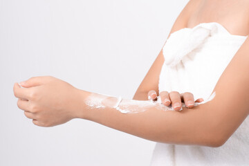 Women use body lotion on your arms in the studio.