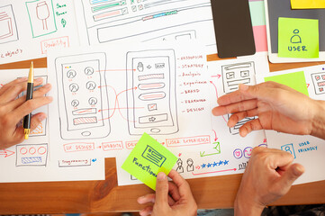 The web designer draws the layout of the mobile application.