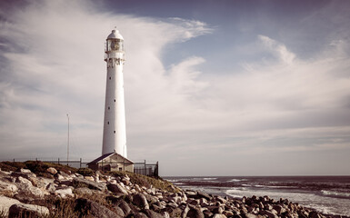 Fototapeta na wymiar Slangkop Lighthouse near the town of Kommetjie in Cape Town, South Africa
