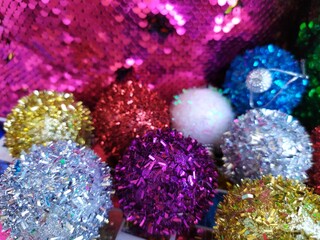 Obraz na płótnie Canvas Colorful shiny christmas balls decorations on a colorful background