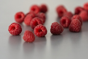 red Raspberry fruit on gray background