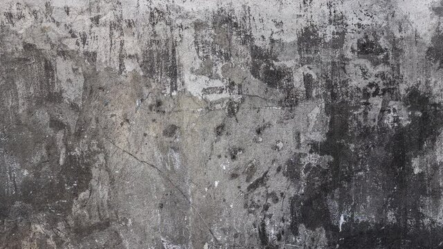 Old cement wall texture fragment with spots and scratches as abstract background. dolly camera movement