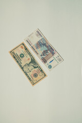 ruble and dollar banknotes lie on a white background