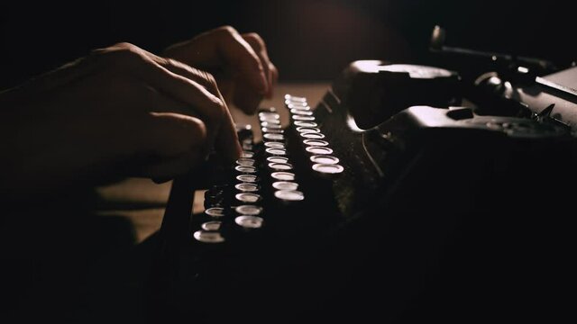 Hands Typing On A Typewriter.